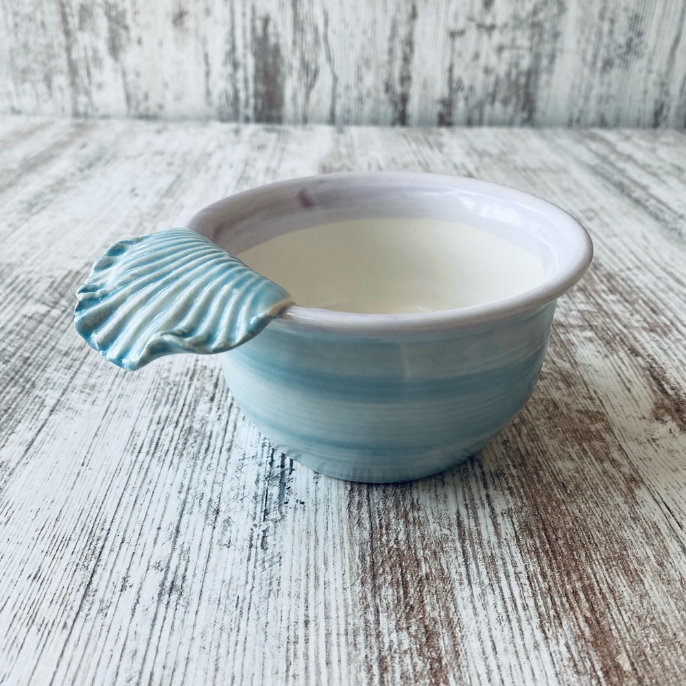 Pottery piece bowl with shell handle